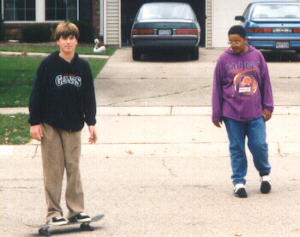 Greg and Chuckie skating in the street