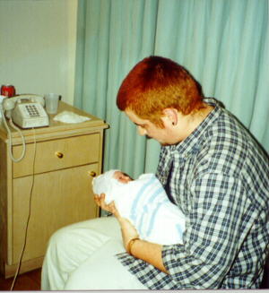 Greg holding Hailey in the hospital, only a day old!